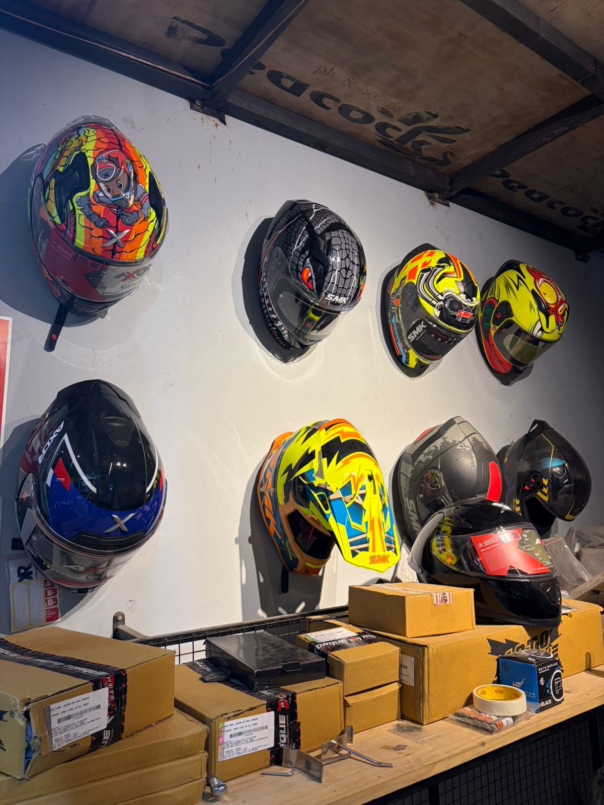 Throttle House storefront with glowing red signage and detailing bay